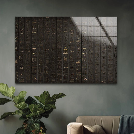A dark, textured grey wall serves as the background for stunning Egyptian hyography glass wall art.