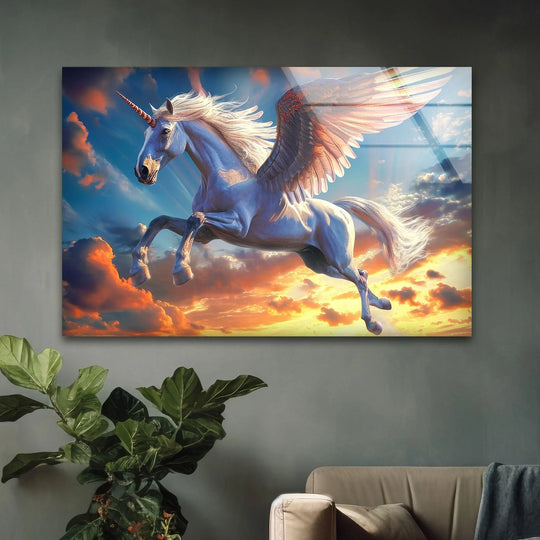 A majestic white winged unicorn with a golden horn soars through a dramatic sunset sky in this vivid hanging wall art.