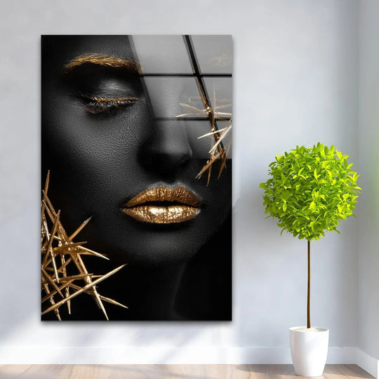 Black and gold accents dominate this stunning glass wall art decor featuring a woman's face.