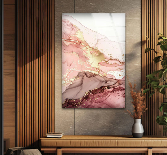 This fluid art from glass showcases swirling pink and gold layers that create a sense of depth and movement.