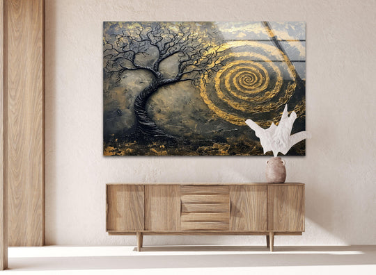 Textured abstract art on glass features a black tree against a golden spiral, showcasing unique modern wall decor.