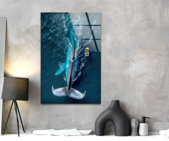 Vibrant blue ocean water and a large whale create a striking scene in this saturated art from glass.