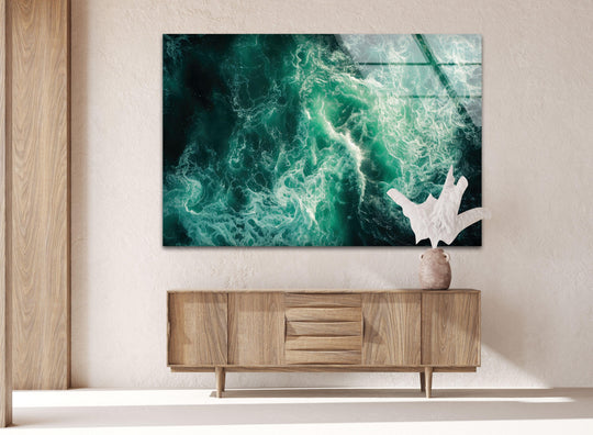 Light and shadow interplay across the green sea waves of this glass wall art, creating a unique modern wall decor piece with a striking depth and visual texture.