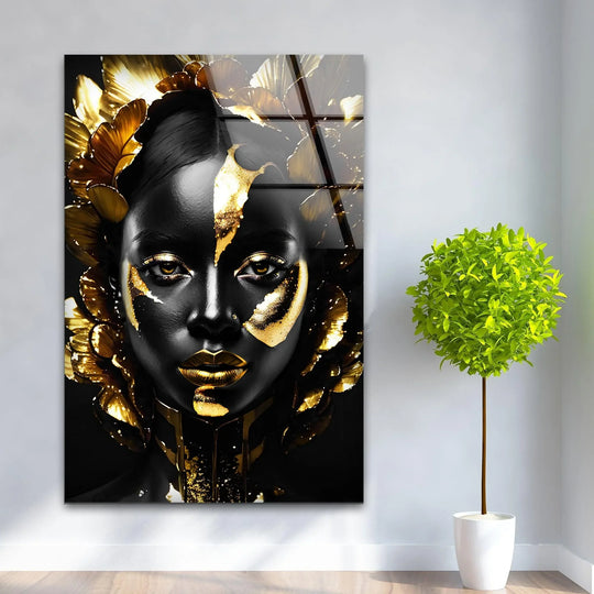 Striking black woman with gold accents showcased on premium glass wall art, representing the best glass art.