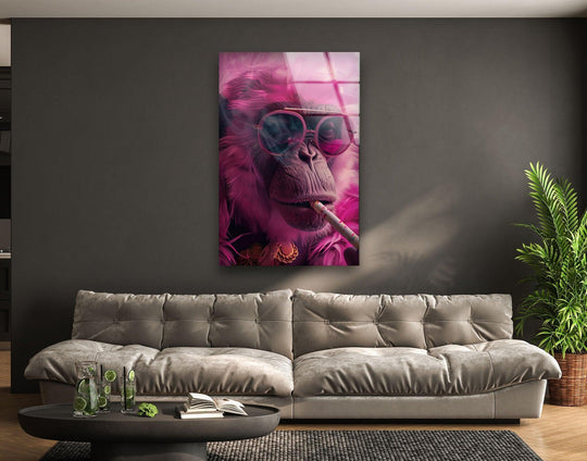 Bold pink monkey tempered glass wall art pops against the dark wall, creating striking visual contrast.
