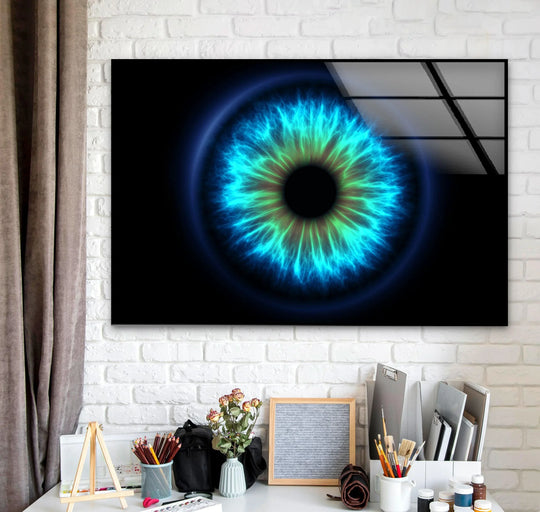 A stunning glass print wall art of a vibrant blue and green eye, showcasing organic, fiery forms and a radiating glow.
