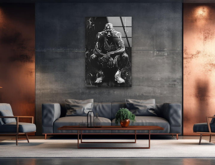 Expressive monochrome sports artwork on glass displaying a basketball player resting with dramatic lighting.