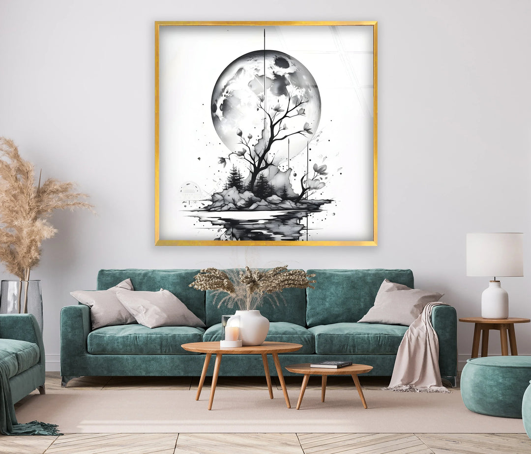 Black and white glass art showing a tree and rocky island under a luminous moon.
