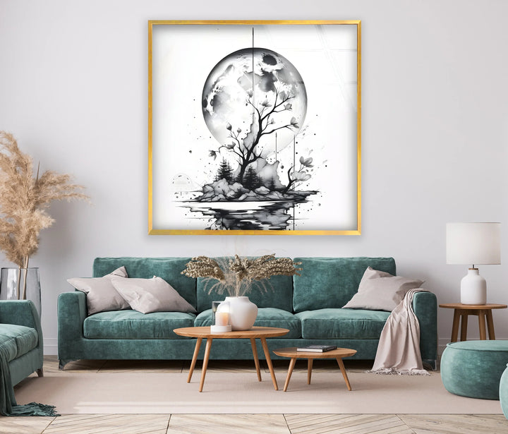 Black and white glass art showing a tree and rocky island under a luminous moon.