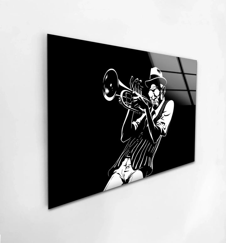 Black and white glass wall art of a jazz musician playing trumpet in bold graphic style.