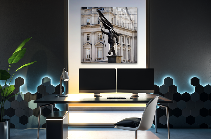 The sleek borders and clean edges of the framed Banksy Freedom Statue glass home decor create a sharp display.