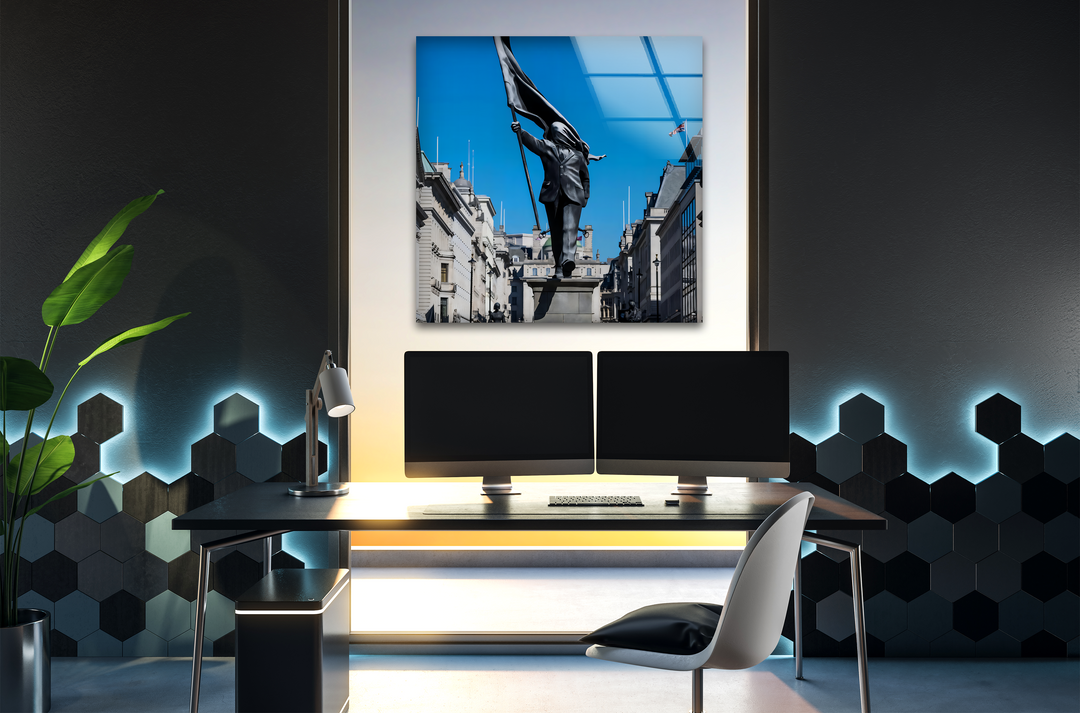 The realistic detail of a vibrant Banksy Freedom March Statue under an azure blue sky is exquisitely captured in this glass printing.