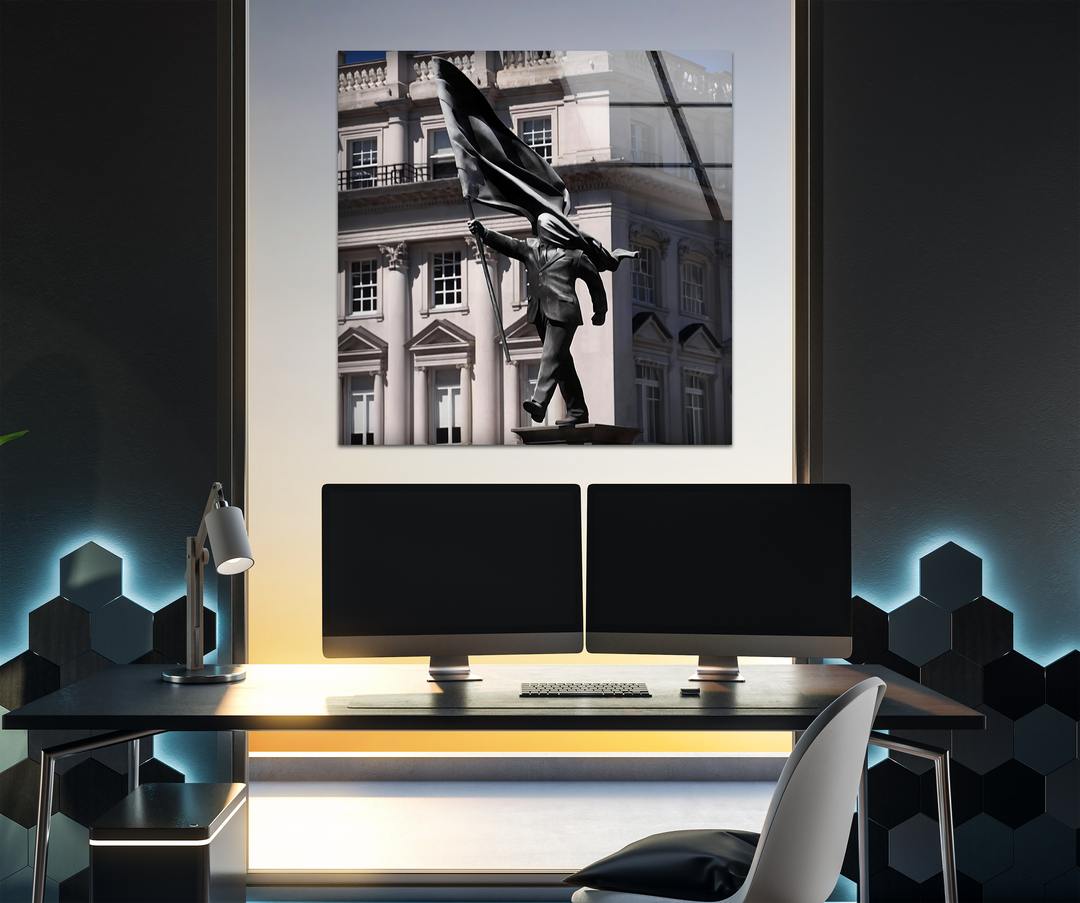 Geometric hexagonal wall panels illuminate a modern office desk with dual rectangular monitors, featuring a framed Banksy Sculpture tempered glass wall art.