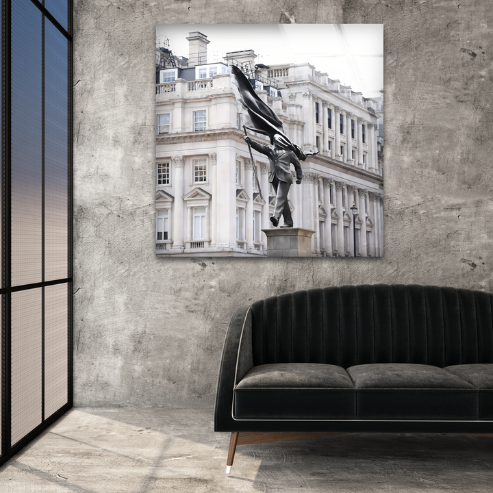 The background showcases a stark, textured concrete wall next to a large window frame, subtly reflecting the sky, enhancing the modern glass wall prints.