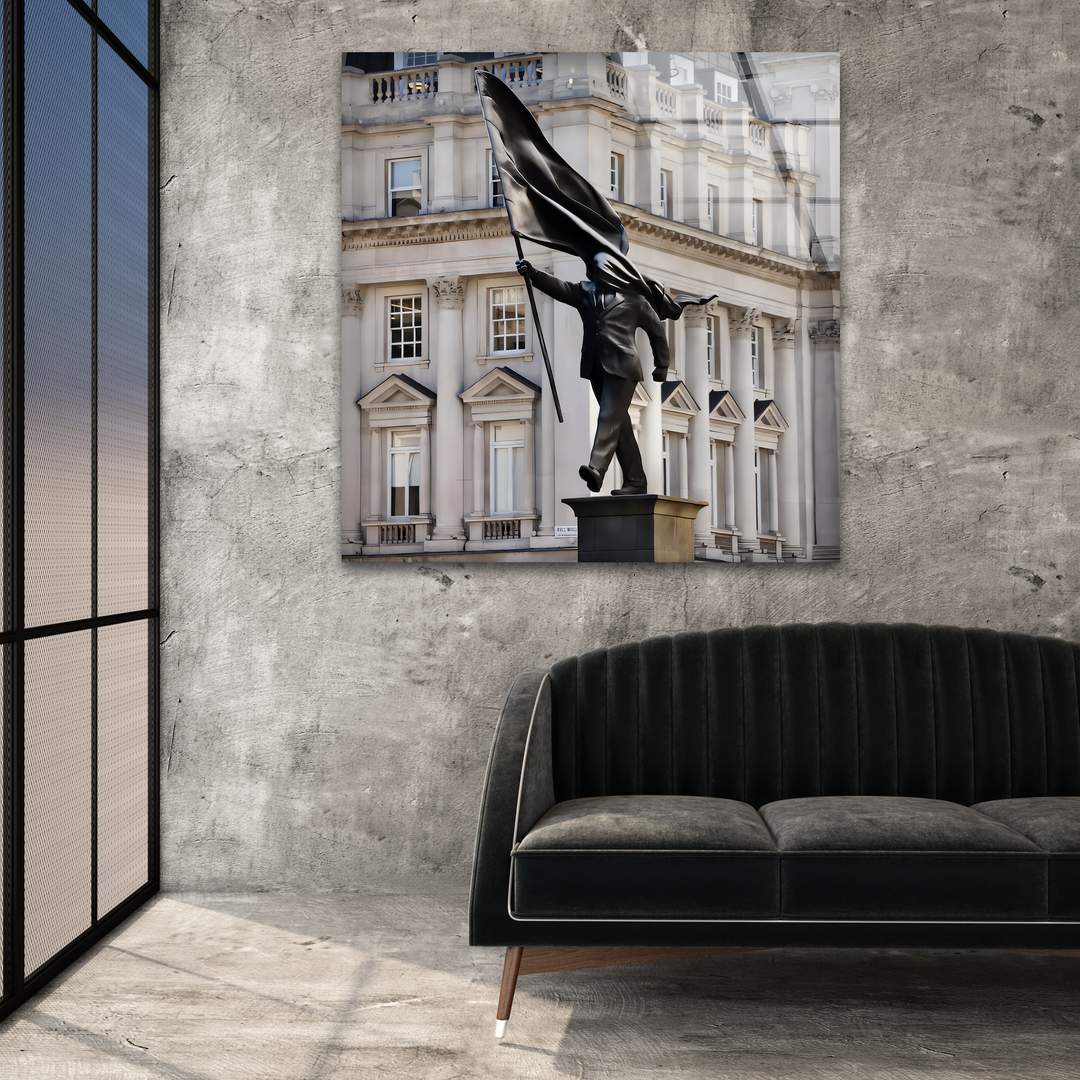 The darkest areas, including the sleek black Stride of Freedom Statue and plush sofa, add depth to this contemporary home decor display.