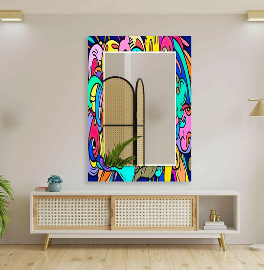 Organic forms swirl around the edge of this colorful pop art glass wall mirror for wall decor, creating an energetic focal point.