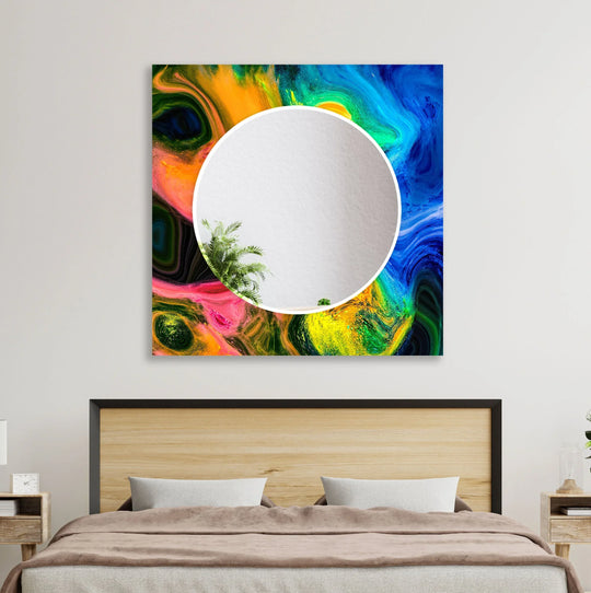 The decorative wall mirror features blue and orange abstract art with a circular mirror and the bold wall mirror adds energy to the room and is easy to clean