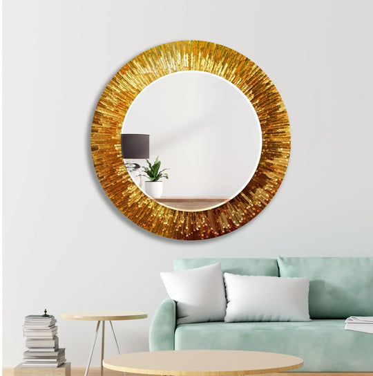 Round Mirror with a golden textured frame and tempered glass reflecting a lamp and plant offers a bold decorative wall mirror