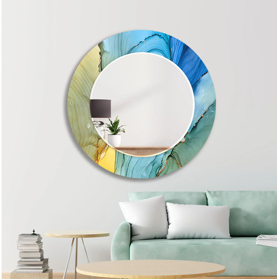 Round blue abstract wall mirror with fluid art design and vibrant yellow green gold colors perfect as a vanity mirror on a white wall