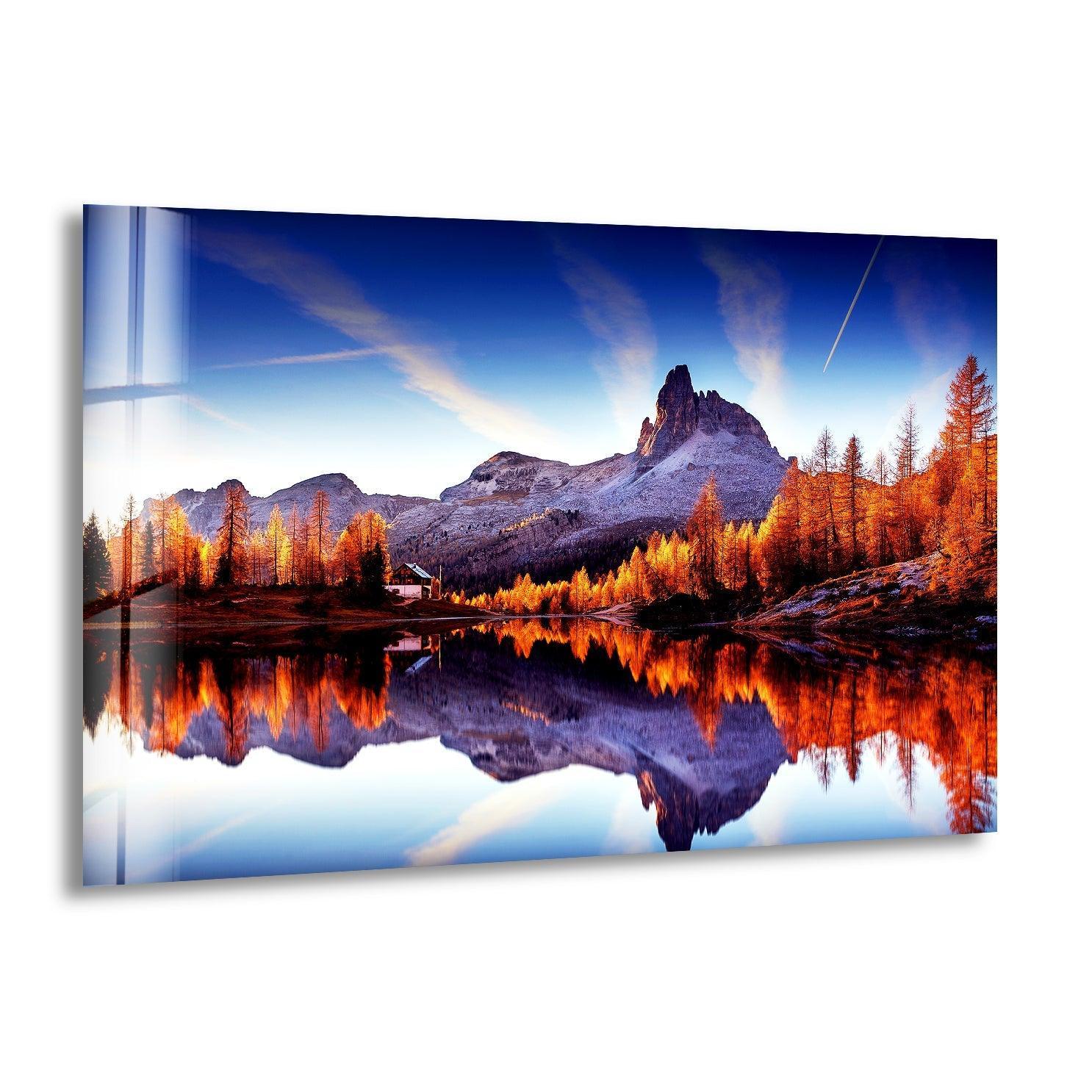 Showcasing the realistic detail, the majestic sunset mountains glass wall artwork reflects vibrant fall colors in a serene lake, capturing a tranquil mountain landscape.