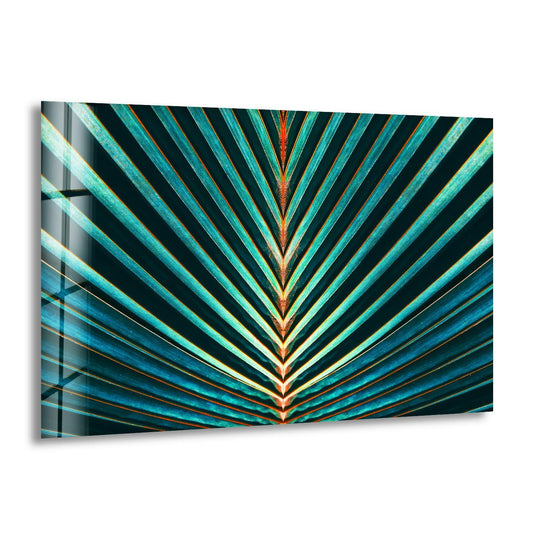 A vibrant green palm leaf displays cool blue and warm orange hues, a striking piece of unique modern wall decor.
