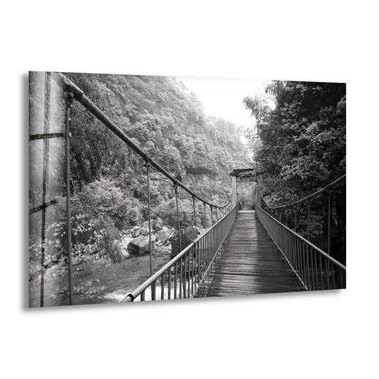 Canvas wall art depicting a tranquil old black and white bridge over a serene forest stream.