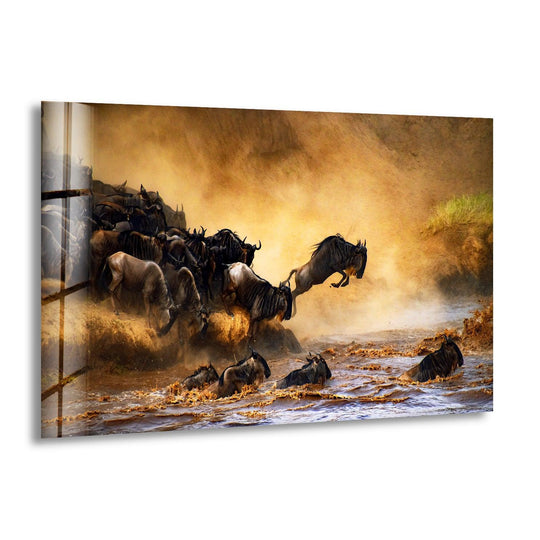 A hazy, golden savanna background sets the stage for wildebeests crossing a river, captured on this hanging wall art.