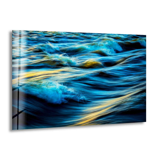 Ocean waves glass wall art shows a blue and gold landscape artwork and a stunning sea energy scene ideal as modern wall decor