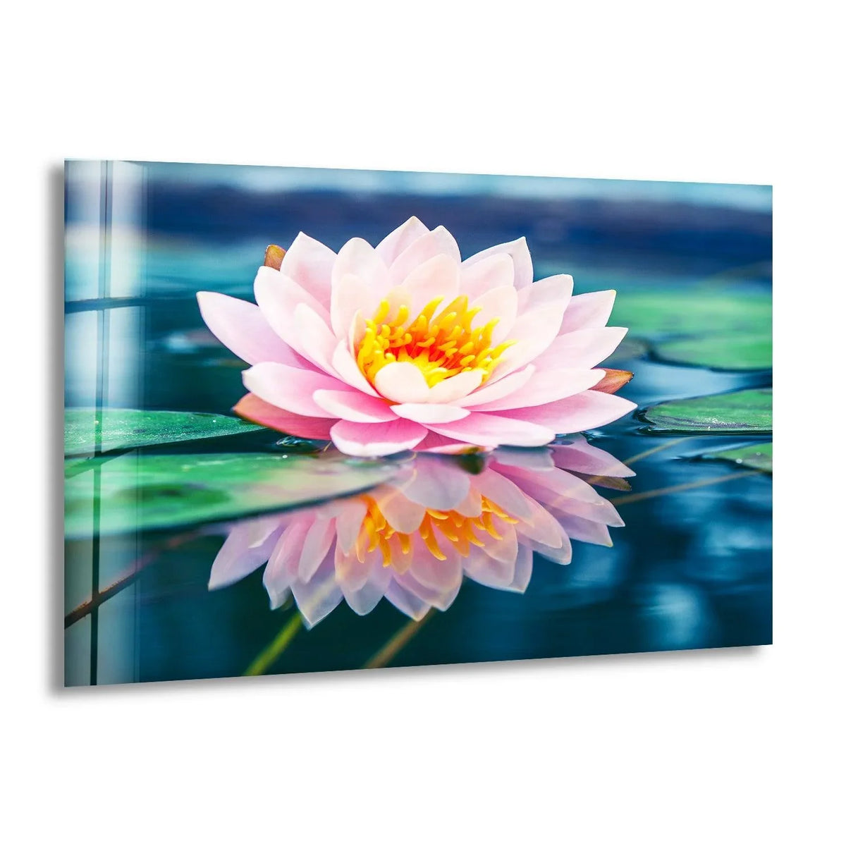 The brightest area of this glass art highlights the vibrant yellow and orange center of the pink lotus flower.