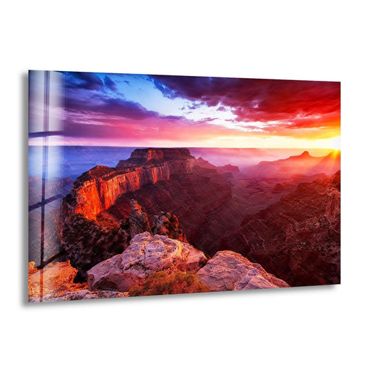Clouds roll across the Grand Canyon at sunset, infusing a sense of movement into this majestic landscape wall art prints on glass.