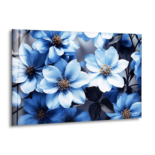 Glass printing of lush blue dahlias with delicate golden centers and dark leaves.