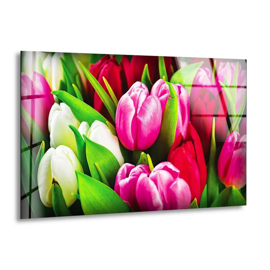 Transitions between pink, red, and white tulips create a visually stunning display in this colorful floral wall art, showcasing the best glass art for vibrant beauty.