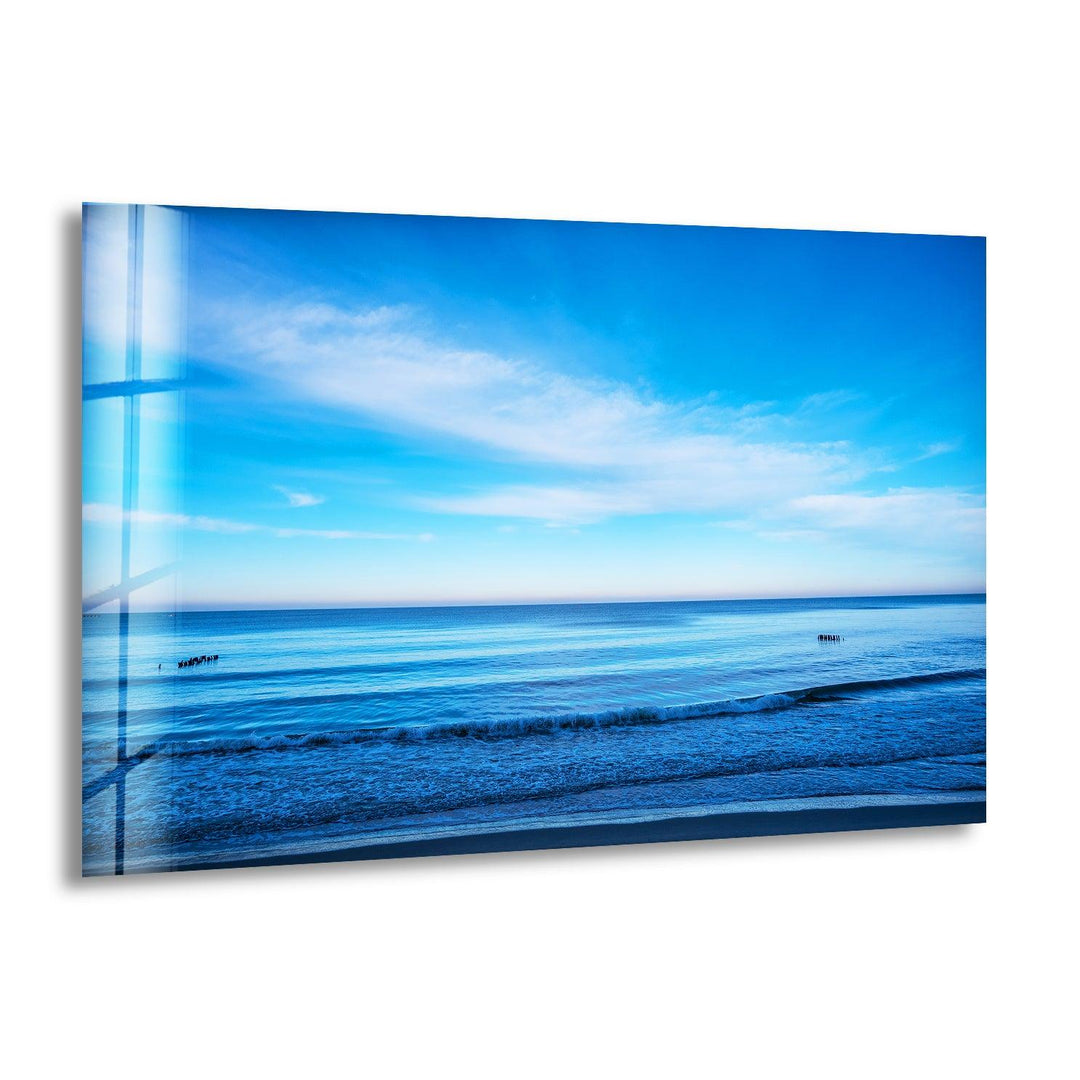 A breathtaking ocean horizon with clear blue skies and gentle waves.
