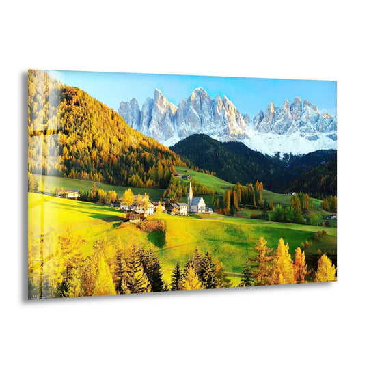 Framing the Val Di Funes glass art painting, a dramatic mountain range rises in the background, partially covered with snow.