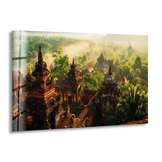 Light and shadow play across the Monasteries Glass Wall Art, highlighting the intricate details and contrasting the dark architecture with the bright, surrounding jungle in this evocative art from glass.