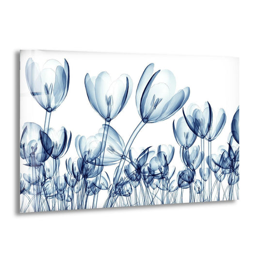 The brightest area of this tempered glass wall art showcases ethereal X-ray blue tulip flowers with translucent petals.