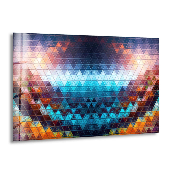 Brilliant blues and oranges in this geometric prism offer the loudest element, drawing the eye to this colorful triangle mosaic glass wall artwork.
