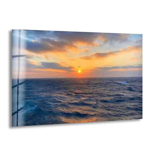 Gradual hues merge in this ocean horizon sunset hanging wall art, where a fiery orange descends to the sea's deep indigo in a tempered glass print.