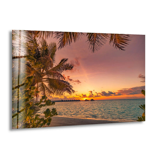 Showcasing the layering effect, this tropical sunset beach wall art features palm trees and an ocean view as beautiful glass wall artwork.