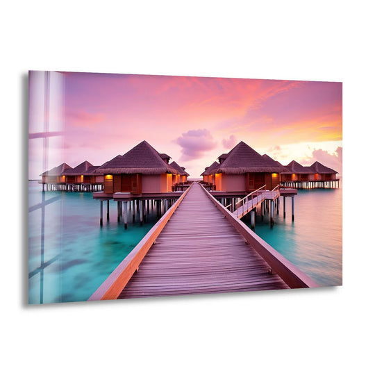 Vast expanses of serene, tropical water surround these Maldives sunset resort bungalows, emphasizing the light and spacious composition of this striking print wall art piece.
