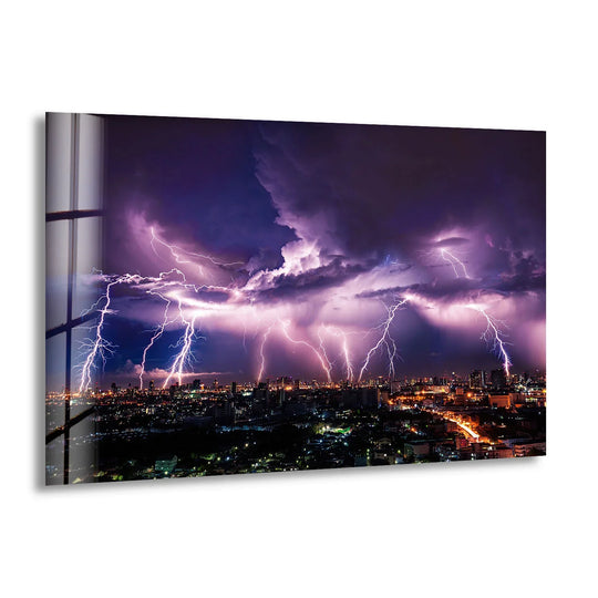 The focal point showcases a purple lightning storm dramatically illuminating the cityscape below, a stunning decorative wall art piece on glass.