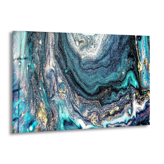 A cool-toned glass art painting of swirling teal and gold galaxies, evoking a cosmic, deep-space color temperature.