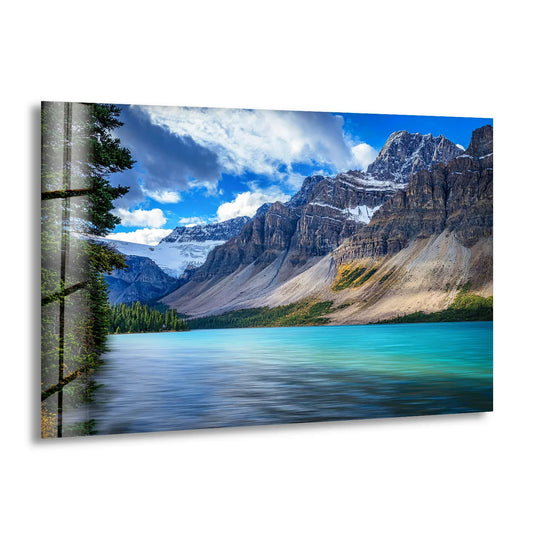 Dominant turquoise hues define this scenic lake and mountain tempered glass wall art, creating a vibrant nature print perfect for modern homes.
