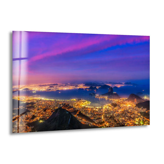 Smooth surface texture enhances the radiant city lights of Rio's night skyline in this vibrant glass wall art prints, showcasing an exquisite urban landscape.