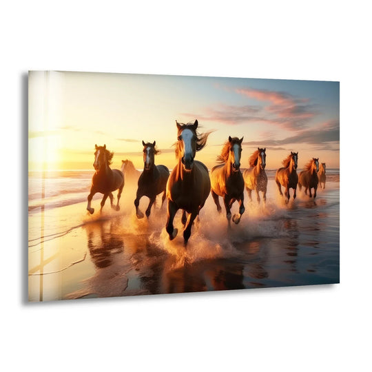 Realistic glass wall artwork captures powerful horses galloping on a sandy beach during a vibrant sunset.