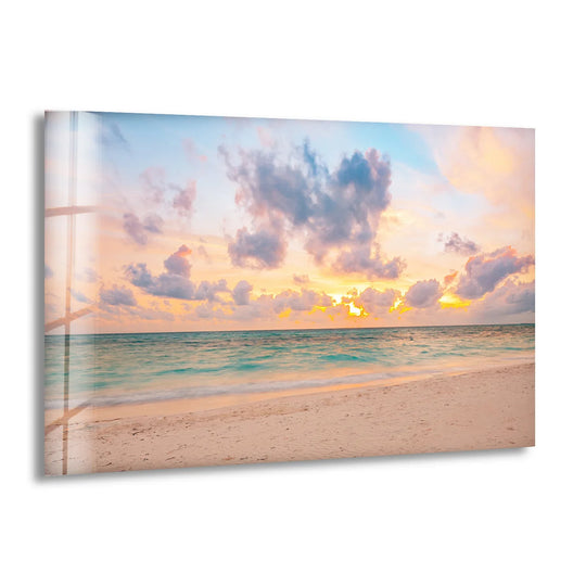 Striking color contrast between the warm sunset tones and cool azure ocean defines this tranquil pastel beach glass wall art decor, enhancing its shoreline depiction.