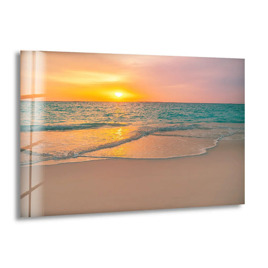 Gentle surf meets the shore in this tranquil beach scene, illuminating the organic forms of the ocean with the soft orange glow of tempered glass wall art.