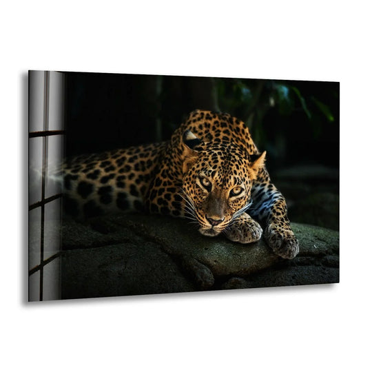 A fierce leopard is captured in realistic detail, its spotted coat and intense gaze vividly displayed on this striking glass art.