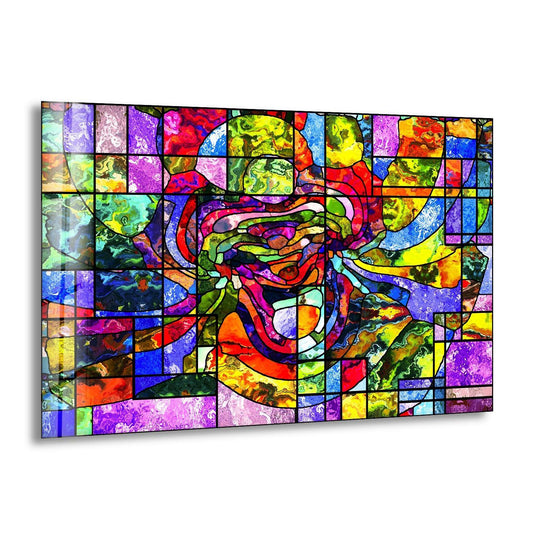 Abstract art from glass featuring organic, flowing forms within a geometric mosaic structure.