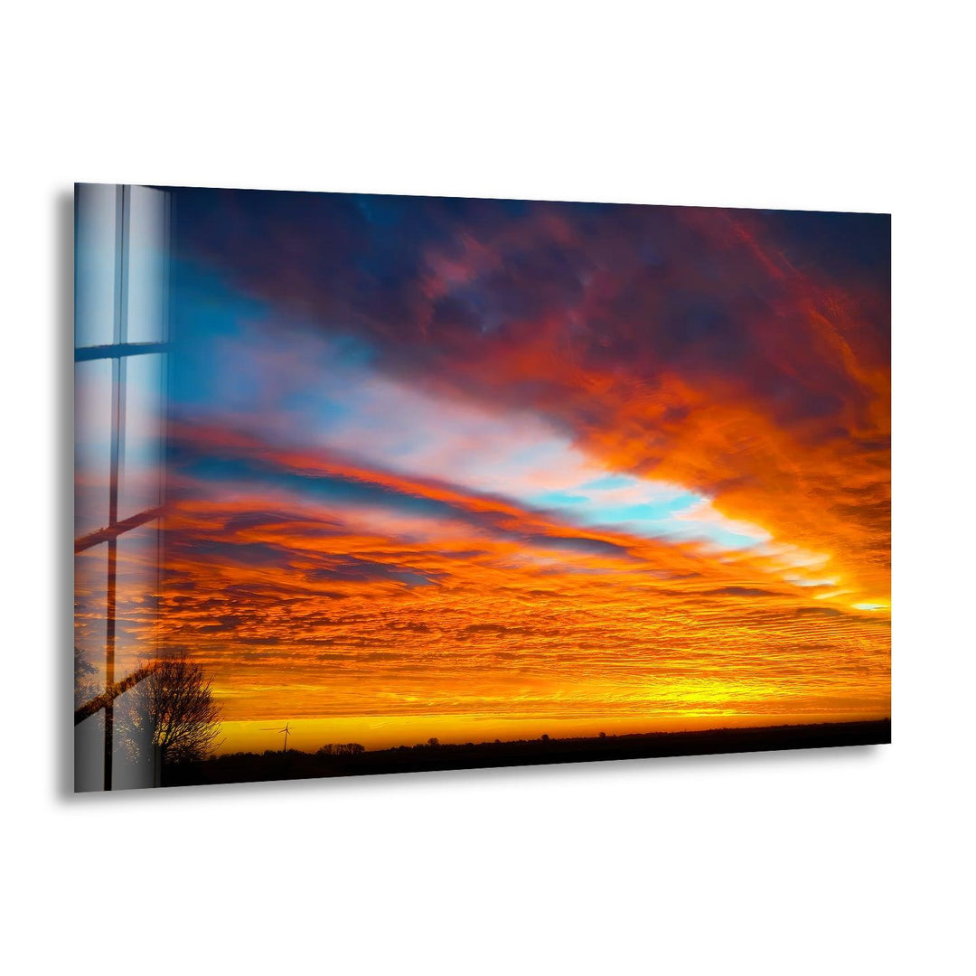 Fiery sunset sky over a calm horizon, captured in stunning detail.
